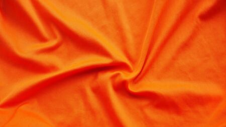 orange silk satin texture, cotton fabric backgroundの写真素材