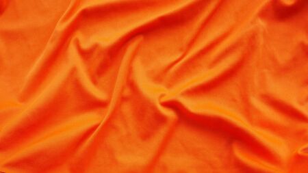orange silk satin texture, cotton fabric backgroundの写真素材