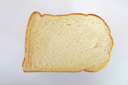 fresh slice of bread on white backgroundの写真素材