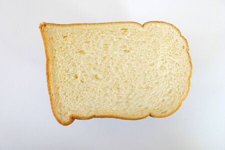 fresh slice of bread on white backgroundの写真素材