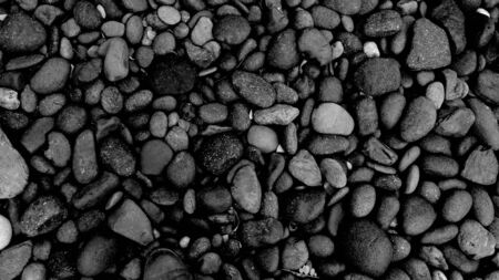 black stone for background, pebble beach stoneの写真素材