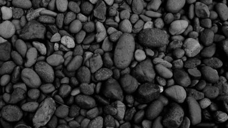 black stone for background, pebble beach stoneの写真素材