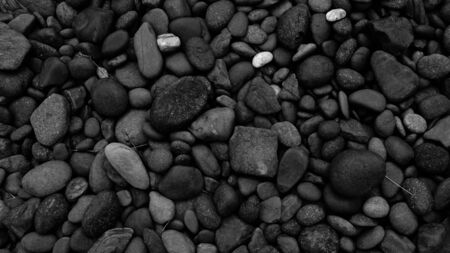 black stone for background, pebble beach stoneの写真素材
