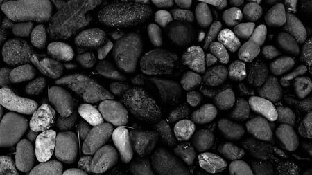 black stone for background, pebble beach stoneの写真素材
