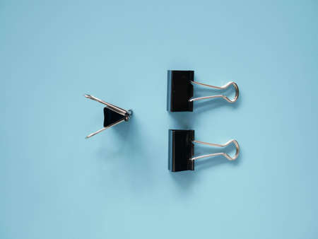 vintage Binder clip on blue backgroundの写真素材