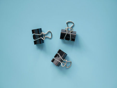 Black Binder clip on background