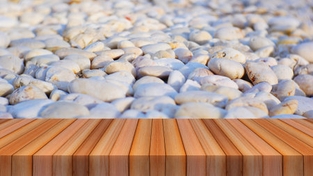 wood table and pebble stone texture on the ground for product display