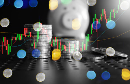 graph and rows of coins for finance and business conceptの写真素材
