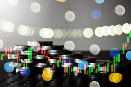graph and rows of coins for finance and business concept