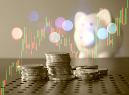 graph and rows of coins for finance and business conceptの写真素材