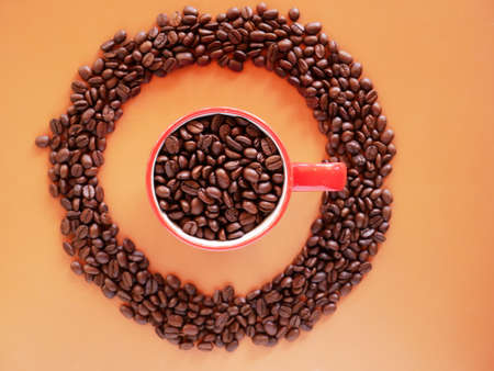 Black coffee cup on background with Coffee beansの写真素材