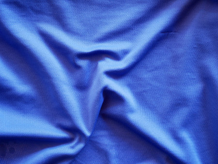 Smooth elegant dark blue silk textured background.