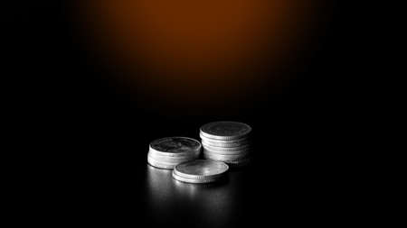 stacks of gold coin on black background concept saving moneyの写真素材
