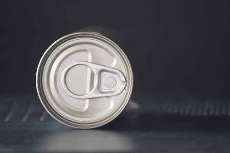 Aluminum can on background. blur tinned on table