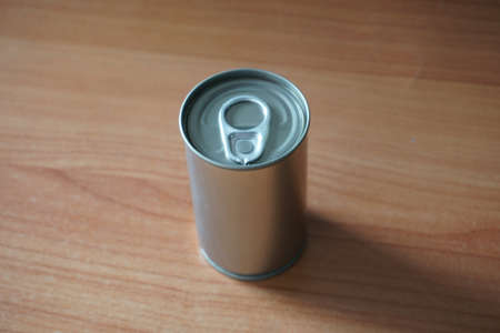 Aluminum can on background. blur tinned on tableの写真素材