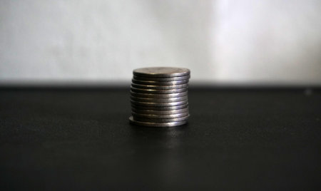 stacks of coin on black background concept save money