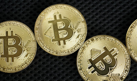 bitcoin on black background with selective focus