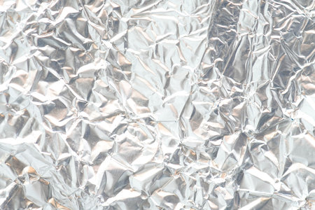 Crumpled metal foil texture background, aluminum foil texture