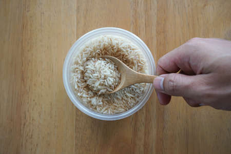 Organic raw rice on backgroundの写真素材