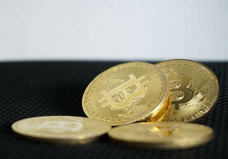 Golden bitcoin digital money on black background with copy spaceの写真素材