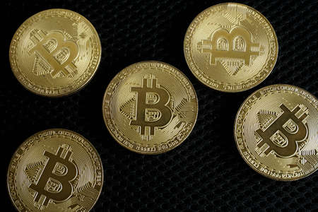 Golden bitcoin digital money on black background with copy spaceの写真素材