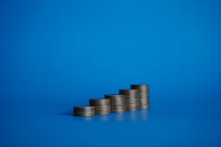 stack coins money on blue background