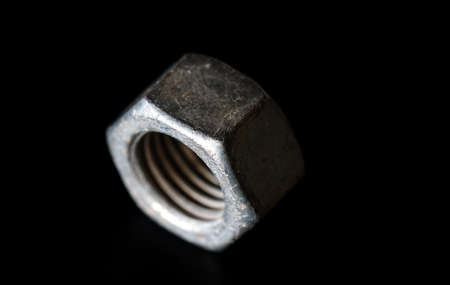 Old rusty nut, metal screw and boltの写真素材