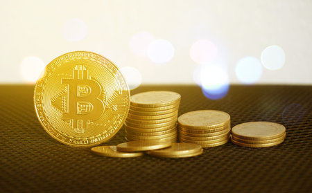 Bitcoin and defocused background. Virtual cryptocurrency concept.