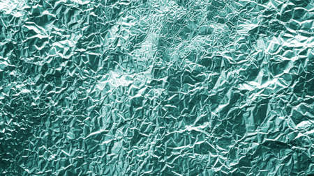 crumpled foil shiny metal texture background wrapping paper for wallpaper decoration element.の写真素材
