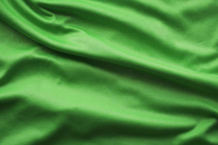 green silk fabric background, green sportwear cloth textureの写真素材