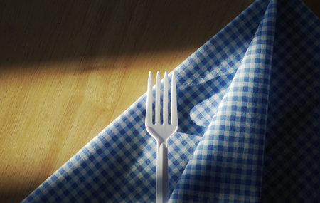 fork and spoon on a napkinの写真素材