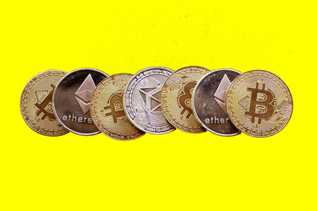 bitcoin cryptography digital money, coins yellow backgroundの写真素材