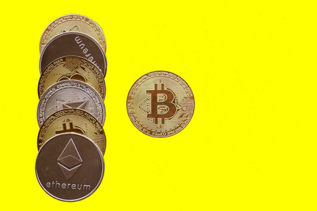 bitcoin cryptography digital money, coins yellow backgroundの写真素材