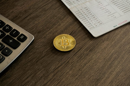 money coin on office desk with bank book and calculator. Business and financial concept.の写真素材