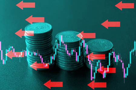 Stacks of coins with forex chart and red arrow on green backgroundの写真素材