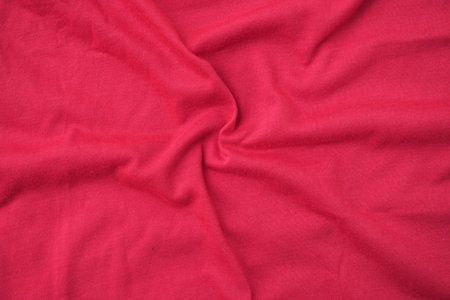 Red crumpled fabric texture background. Top view. Copy space.の写真素材