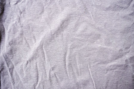 Crumpled white cotton fabric texture for background. Top view.の写真素材