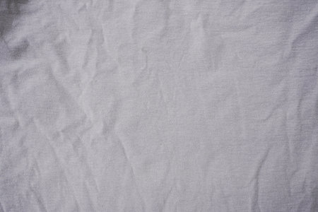 Crumpled white fabric texture background. Top view, copy space.の写真素材