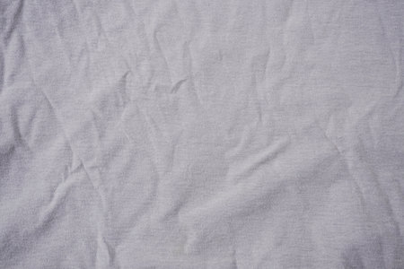 Crumpled white fabric texture for background. Top view. Copy space.の写真素材
