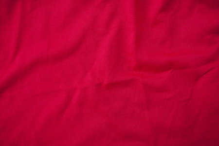 Red crumpled fabric texture for background. Top view. Copy space.の写真素材