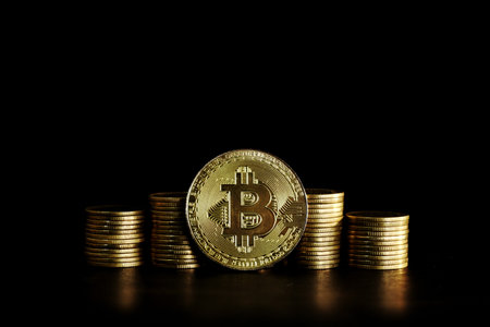 golden bitcoin coin on black background, business concept, copy spaceの写真素材