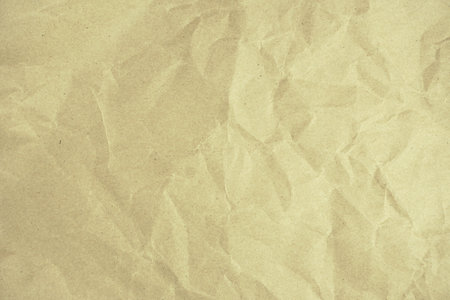 Recycled crumpled brown paper texture or background for design with copy space for text or image.の写真素材