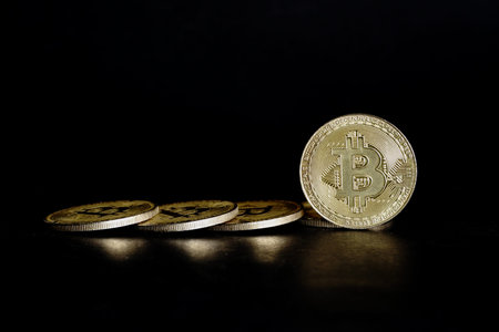 golden bitcoin on black background with copy space for your text.
