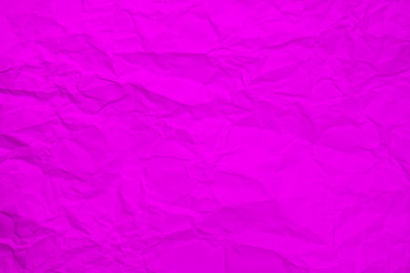 Purple crumpled paper background or texture. Pink paper sheet.の写真素材