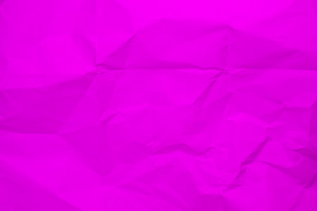 Pink creased crumpled paper background grunge texture backdrop.の写真素材