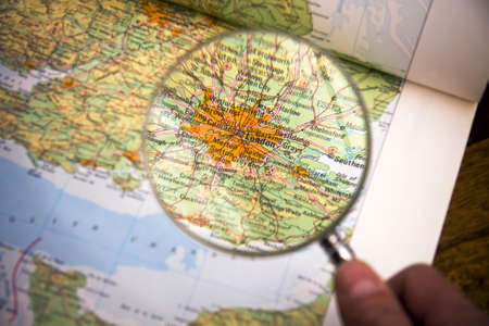 Magnifying glass over a map showing londonの写真素材