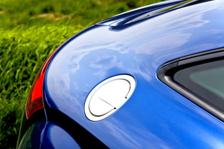 Close-up of fuel filler cap and car bodyの写真素材