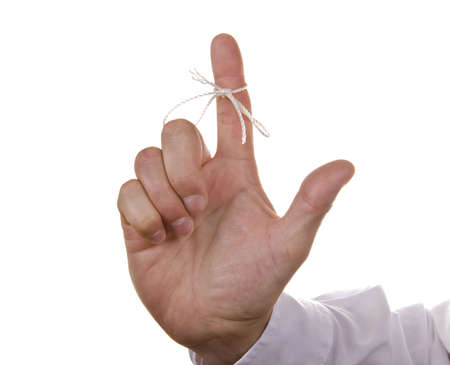 String knot tied on finger as reminderの写真素材
