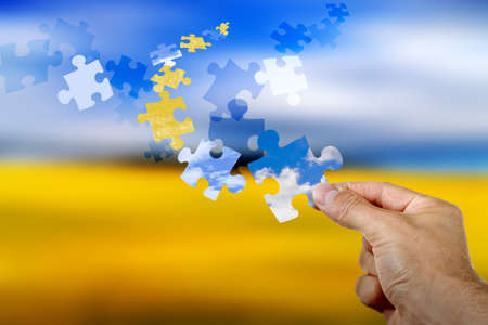 Colorful puzzle pieces flying through the skyの写真素材