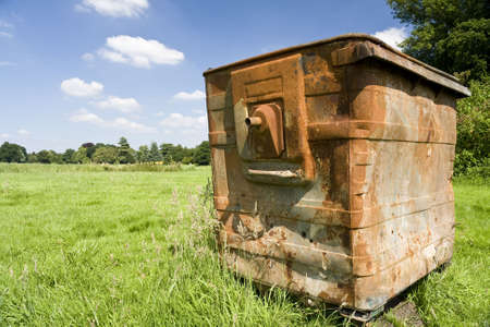 Rusty old skip forgotten in a fieldの写真素材